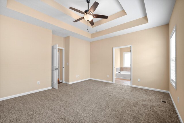 1313 Allmon Dr, Clarksville, TN 37042 - unfurnished room featuring ceiling fan, a tray ceiling, carpet flooring, and baseboards