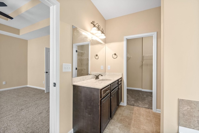 1313 Allmon Dr, Clarksville, TN 37042 - bathroom with vanity, a walk in closet, baseboards, and tile patterned floors