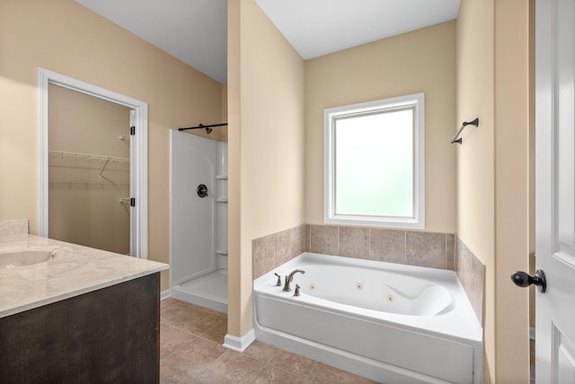 1313 Allmon Dr, Clarksville, TN 37042 - full bathroom featuring a whirlpool tub, walk in shower, tile patterned flooring, vanity, and a spacious closet