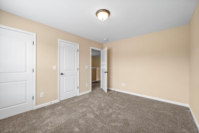 1313 Allmon Dr, Clarksville, TN 37042 - unfurnished bedroom featuring carpet and baseboards