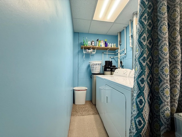 washroom with washer and clothes dryer and laundry area