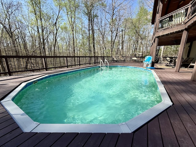 view of swimming pool with a fenced in pool