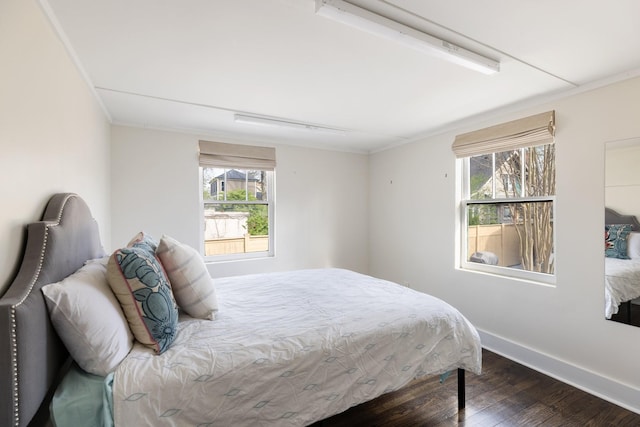 4610 Elkins Ave, Nashville, TN 37209 - bedroom with dark wood-style floors, crown molding, and baseboards