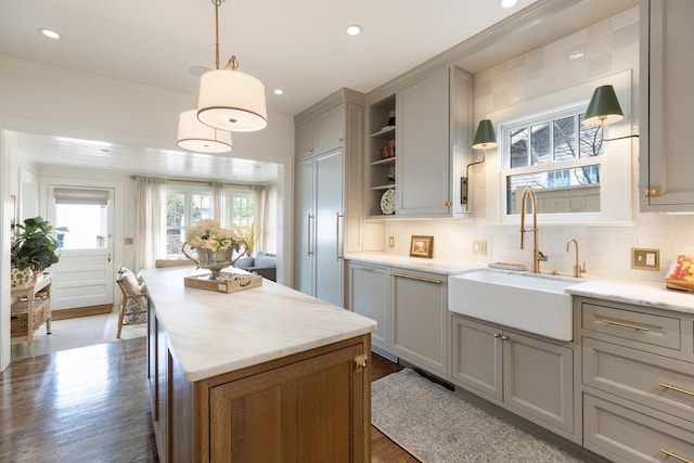 4610 Elkins Ave, Nashville, TN 37209 - kitchen featuring a sink, gray cabinetry, open shelves, a kitchen island, and wood finished floors