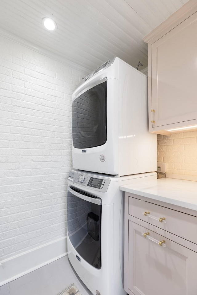 4610 Elkins Ave, Nashville, TN 37209 - clothes washing area featuring estacked washer and dryer, cabinet space, and recessed lighting