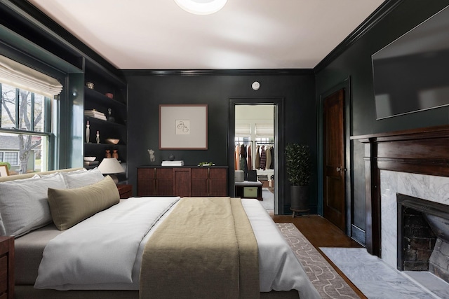 4610 Elkins Ave, Nashville, TN 37209 - bedroom featuring multiple windows, a high end fireplace, crown molding, and a walk in closet