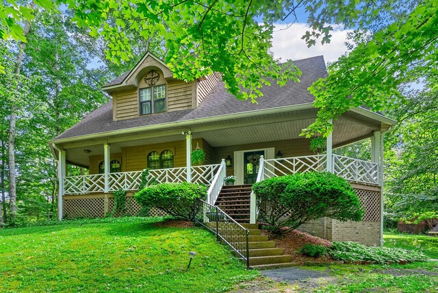 4862 Louise Rd, Cumberland Furnace, TN 37051 - view of front of home with covered porch, a shingled roof, stairway, and a front lawn