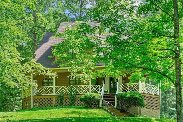 4862 Louise Rd, Cumberland Furnace, TN 37051 - view of front of house with a shingled roof, a front lawn, and covered porch