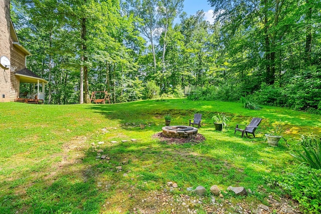 4862 Louise Rd, Cumberland Furnace, TN 37051 - view of grassy yard with an outdoor fire pit
