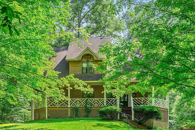 4862 Louise Rd, Cumberland Furnace, TN 37051 - view of front of property with a porch, a front lawn, and a shingled roof