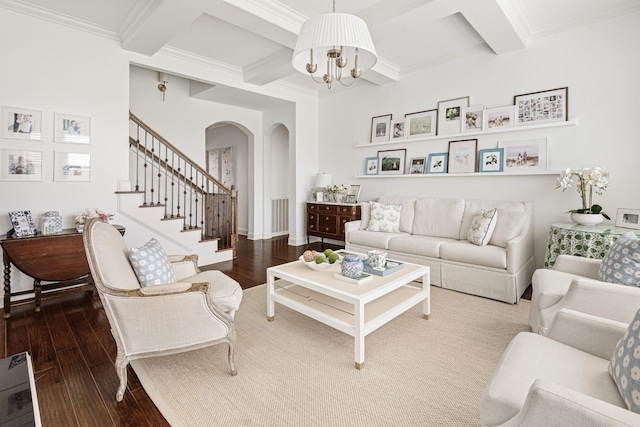 living room with beamed ceiling, an inviting chandelier, arched walkways, hardwood / wood-style floors, and coffered ceiling