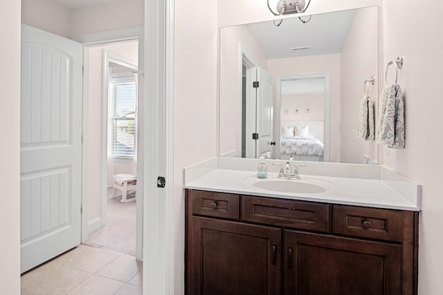 bathroom featuring tile patterned floors, vanity, visible vents, and connected bathroom