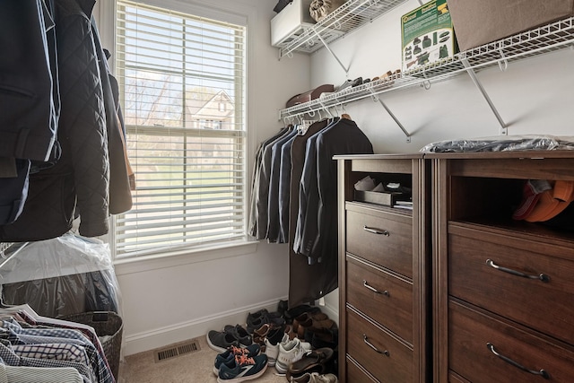 spacious closet featuring visible vents