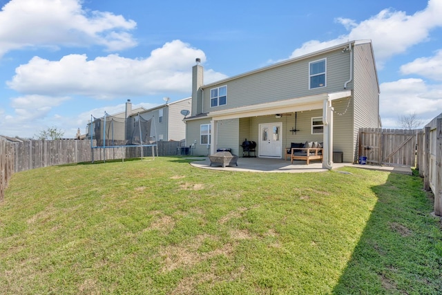 114 Suggs Dr, Lebanon, TN 37087 - rear view of property with a patio area, a yard, a trampoline, a chimney, and a fenced backyard
