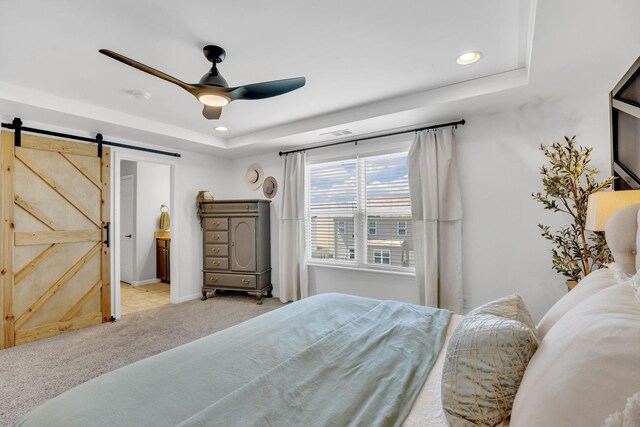 114 Suggs Dr, Lebanon, TN 37087 - bedroom with light carpet, recessed lighting, a ceiling fan, a barn door, and a tray ceiling