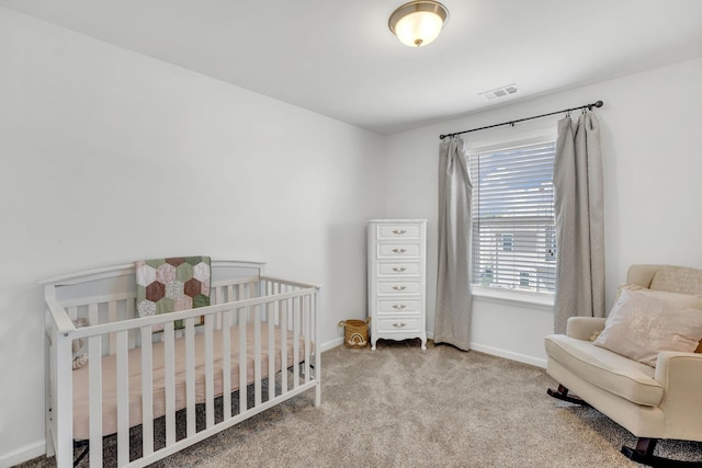 114 Suggs Dr, Lebanon, TN 37087 - carpeted bedroom with visible vents, baseboards, and a nursery area
