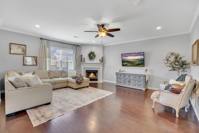 114 Suggs Dr, Lebanon, TN 37087 - living area with crown molding, visible vents, wood finished floors, ceiling fan, and a premium fireplace