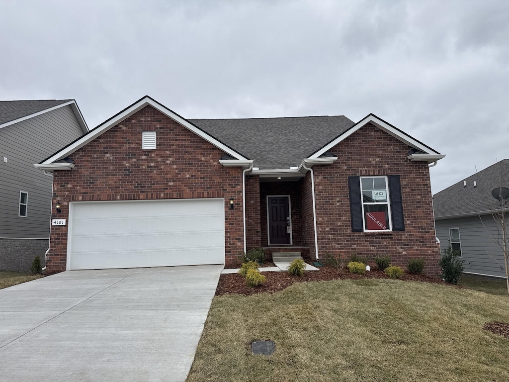 4181 Lively St, Columbia, TN 38401 - ranch-style home with a garage, roof with shingles, a front lawn, brick siding, and concrete driveway