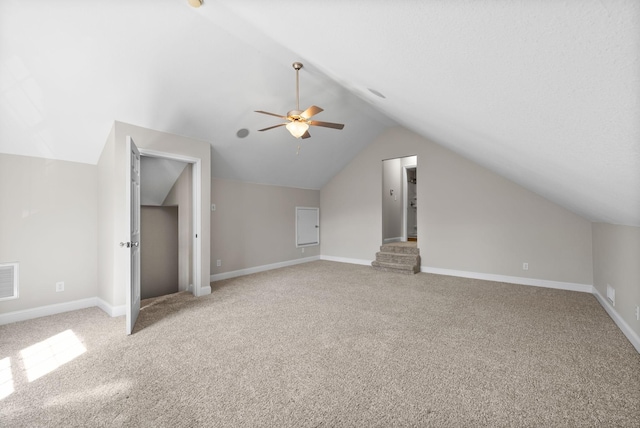 bonus room featuring light carpet, visible vents, baseboards, and lofted ceiling