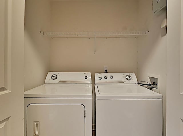 washroom with washer and dryer and laundry area