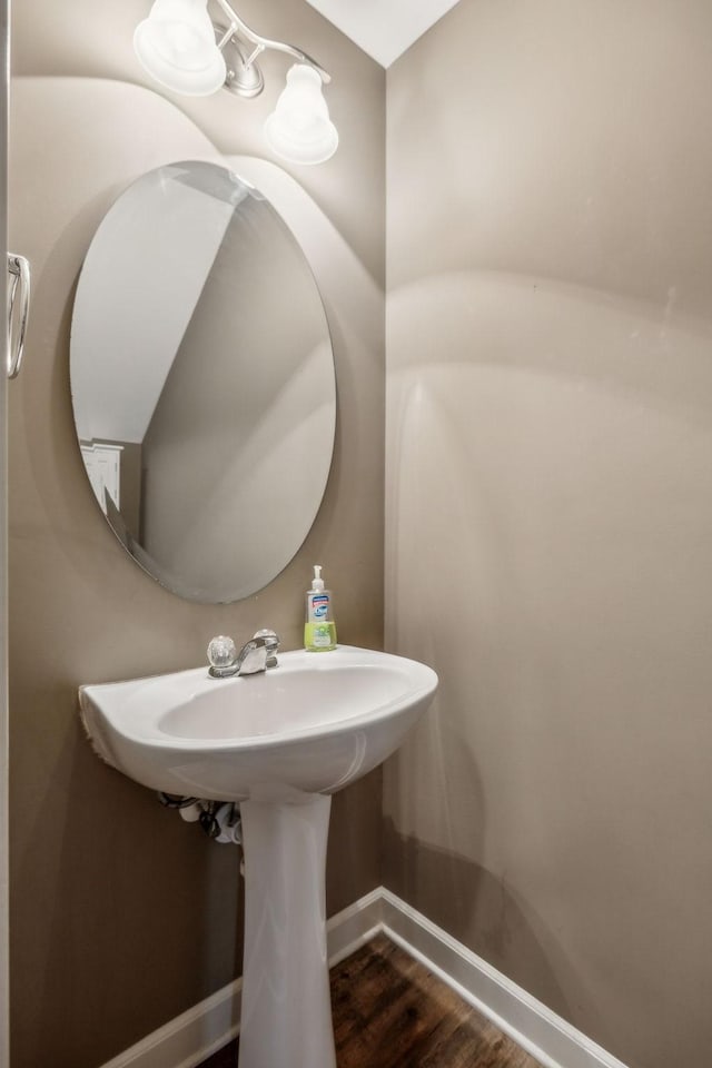 bathroom featuring baseboards and wood finished floors