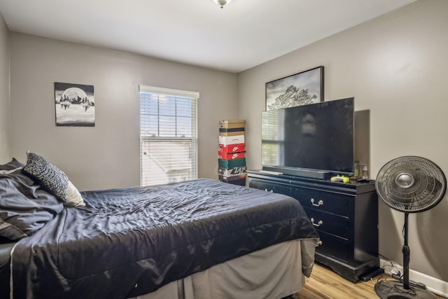 bedroom with light wood finished floors