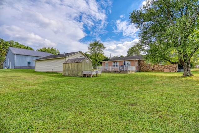view of yard with a storage shed and an outdoor structure