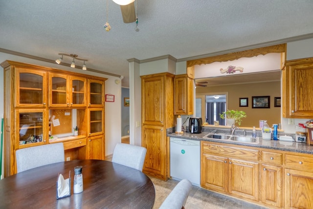 kitchen with a textured ceiling, crown molding, ceiling fan, white dishwasher, and a sink
