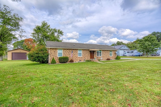 single story home with a detached garage, stone siding, an outdoor structure, and a front yard