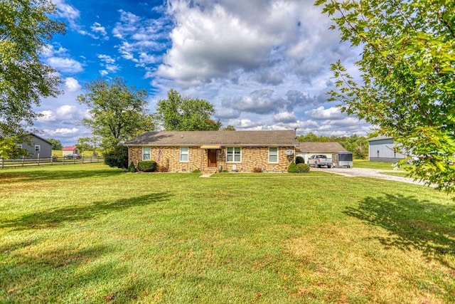 single story home featuring driveway, fence, stone siding, and a front lawn