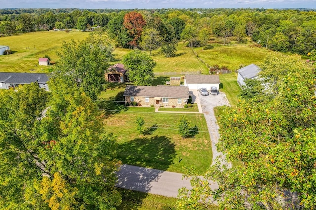 birds eye view of property featuring a rural view and a forest view