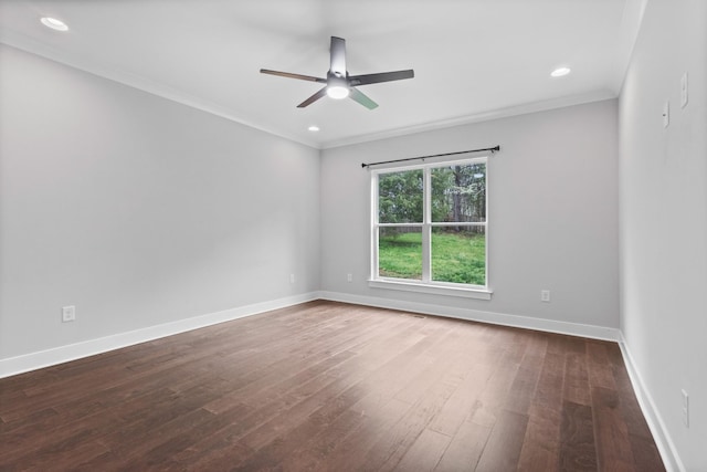 spare room with baseboards, ornamental molding, recessed lighting, a ceiling fan, and dark wood-type flooring