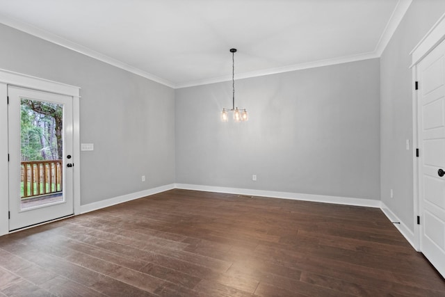 foyer with dark wood-type flooring, baseboards, a notable chandelier, and crown molding