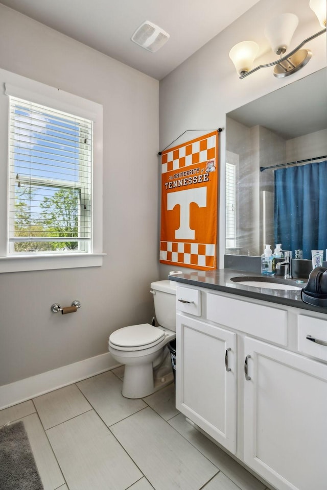 full bathroom featuring vanity, baseboards, toilet, tile patterned flooring, and visible vents