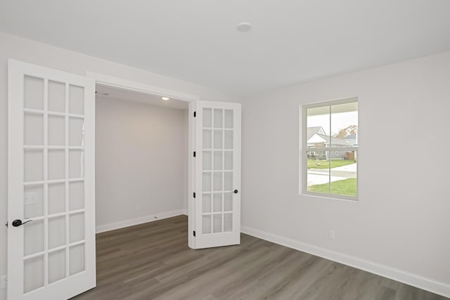 1714 Allwood Ave E, Murfreesboro, TN 37128 - empty room with french doors, baseboards, and wood finished floors
