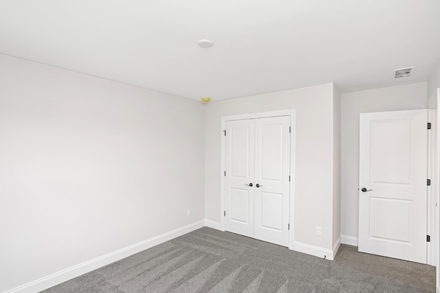 1714 Allwood Ave E, Murfreesboro, TN 37128 - unfurnished bedroom featuring visible vents, baseboards, dark colored carpet, and a closet