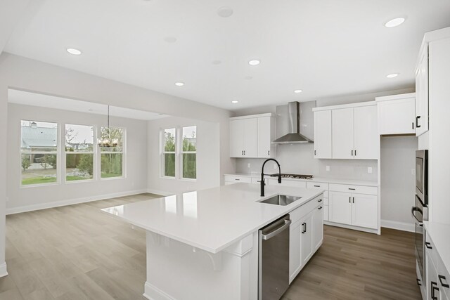 1714 Allwood Ave E, Murfreesboro, TN 37128 - kitchen with an island with sink, light wood-type flooring, wall chimney range hood, a sink, and stainless steel appliances