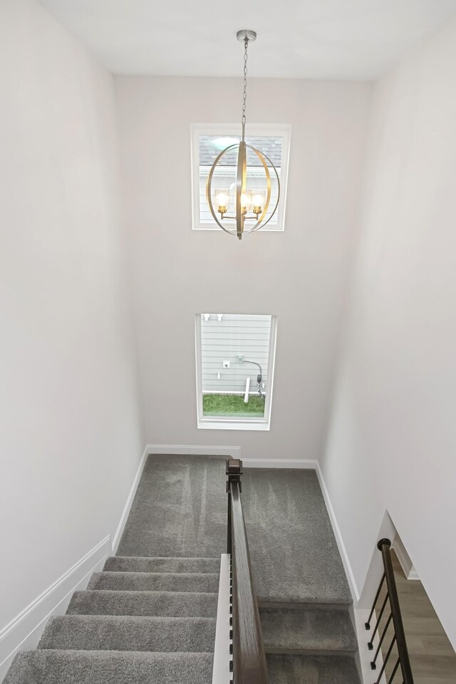 1714 Allwood Ave E, Murfreesboro, TN 37128 - stairway with baseboards, carpet, and a notable chandelier