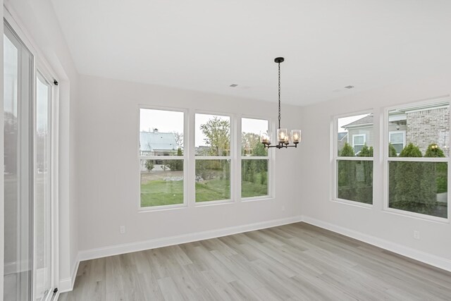 1714 Allwood Ave E, Murfreesboro, TN 37128 - unfurnished dining area with light wood-style flooring, a notable chandelier, and baseboards