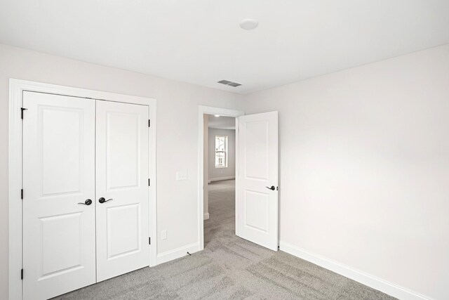1714 Allwood Ave E, Murfreesboro, TN 37128 - unfurnished bedroom with light carpet, a closet, baseboards, and visible vents