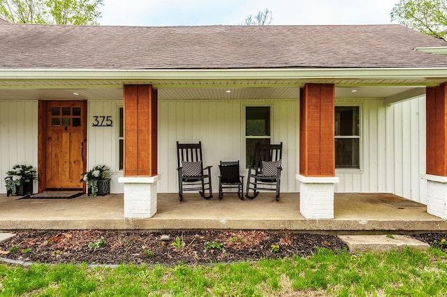 375 Mount Vernon Rd, Bethpage, TN 37022 - view of exterior entry with board and batten siding, a porch, and roof with shingles