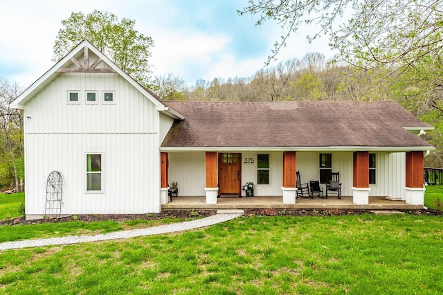 375 Mount Vernon Rd, Bethpage, TN 37022 - view of front of house with roof with shingles, board and batten siding, a front lawn, and covered porch