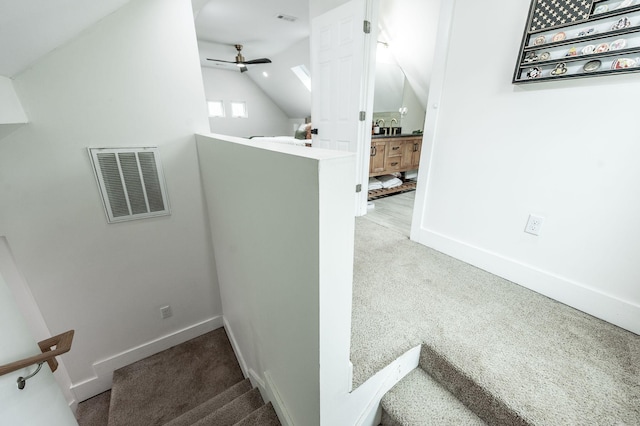 375 Mount Vernon Rd, Bethpage, TN 37022 - staircase with baseboards, vaulted ceiling, visible vents, ceiling fan, and carpet