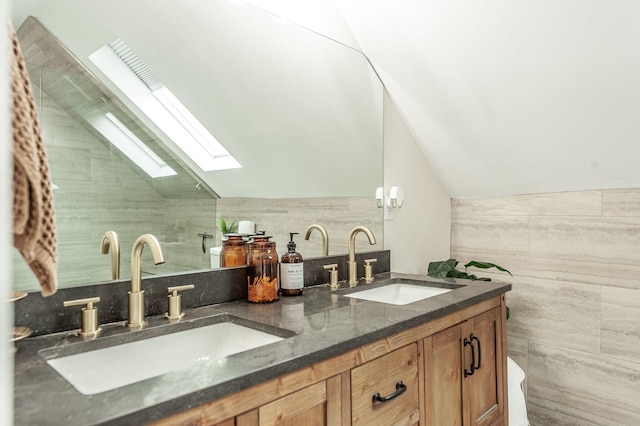 375 Mount Vernon Rd, Bethpage, TN 37022 - full bath with a sink, tile walls, double vanity, and vaulted ceiling