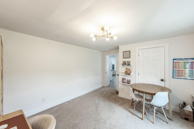 375 Mount Vernon Rd, Bethpage, TN 37022 - dining room with light colored carpet, an inviting chandelier, and baseboards