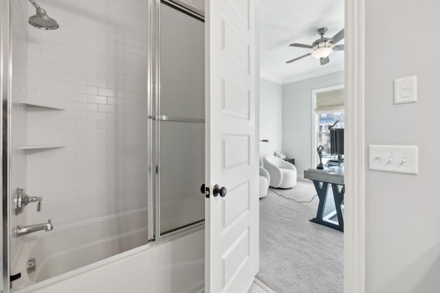 bathroom with ornamental molding, a ceiling fan, and enclosed tub / shower combo