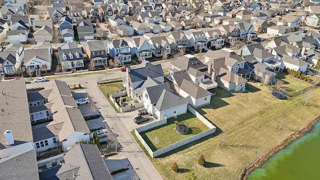 bird's eye view featuring a residential view and a water view