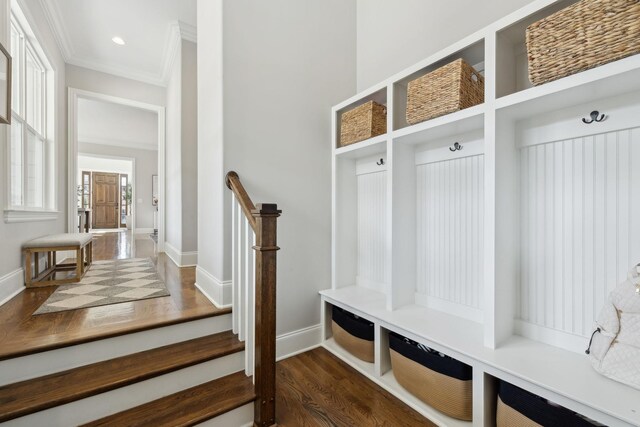 mudroom with wood finished floors, baseboards, ornamental molding, and recessed lighting