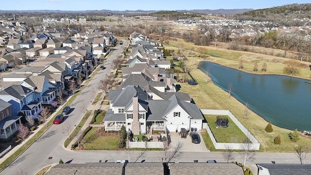 birds eye view of property featuring a residential view and a water view