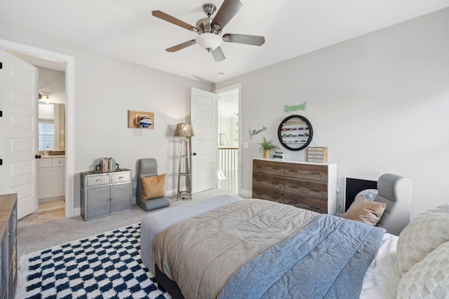 carpeted bedroom featuring baseboards and a ceiling fan